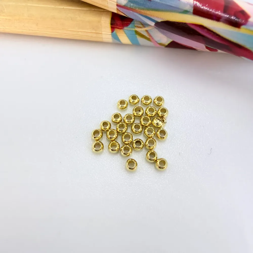 MO52 Bolitas 2 mm Perforación 1 mm Venta por Gramo Accesorio Baño Oro 100006