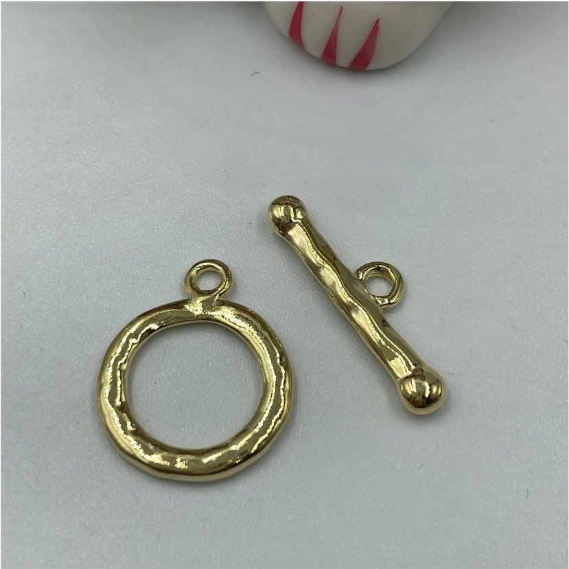 AO103 Broche OT Irregular diá. 15 mm largo palito 20 mm Accesorio Baño Oro 100009