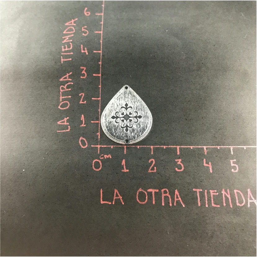 FP519 Gota Flor en Cruz 2 Perforaciones 20 x 25 mm Figura Baño Plata 100015
