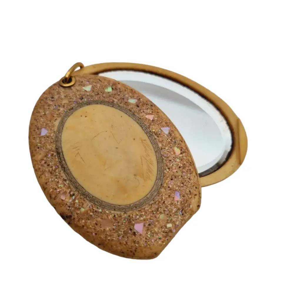 Espejo art déco de galalita con incrustaciones nácar, coleccionismo baquelita.